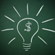 Lightbulb and dollar sign on chalk board