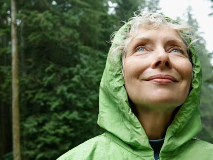 woman hiking in the rain woman hiking in the rain