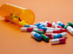 Prescription medication spilling out of bottle Prescription medication spilling out of bottle