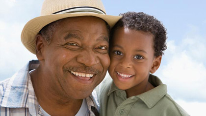 grandfather with smiling grandchild