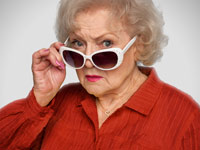 Betty White peers over her sunglasses while promoting AARP membership.