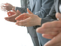 Business people clapping hands