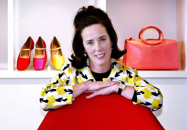 Kate Spade pose with handbags and shoes from her next collection in New York, Thursday