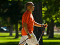 Man walking with poles for senior mobility