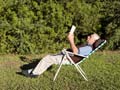 Classic literature and popular novels for seniors- Great Gatsby book cover- mature man reading book outdoors