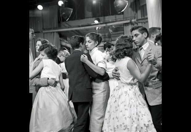 Teenagers slow dance on the television show, American Bandstand. in 1957