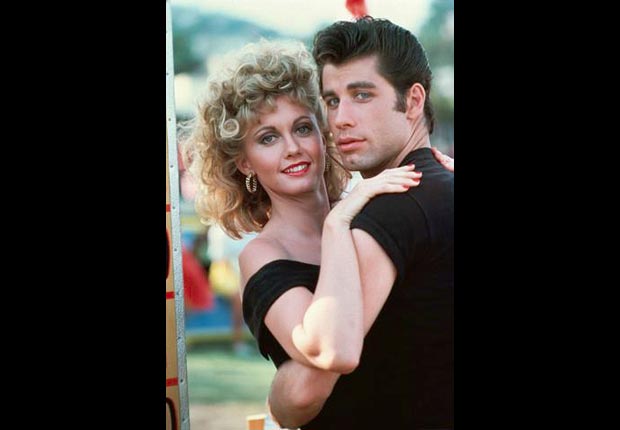 John Travolta embraces Olivia Newton-John on set of Grease.