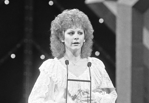 Reba in 1984, and her other notable hairstyles