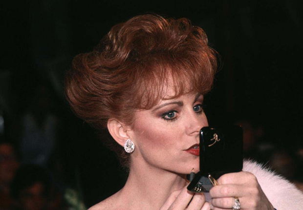 Reba in 1993, and her other notable hairstyles