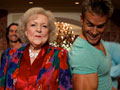 Betty White dancing with a young man