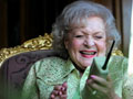 Betty White practices her new mischievous hobby, prank calling, while enjoying life as an AARP member.