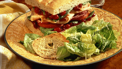 Turkey and cranberry sandwich with salad