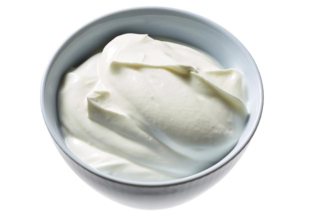 Greek Yogurt in a bowl, shot on white