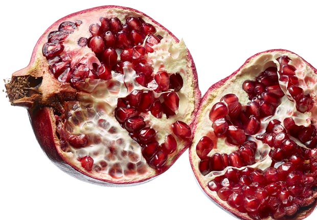 Pomegranates shot on white