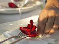 placing flower on dinner plate