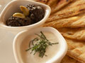 Flatbread with tzaziki, hummus and black olive tapenade