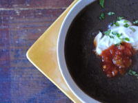 Black bean soup with cumin and salsa verde