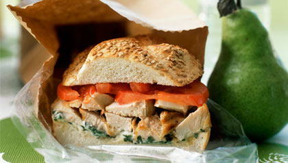 box lunch, sandwich and a pear in brown bag