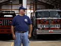 Firefighter John Battistoni in front of a fire engine in Branson, Missouri