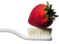 Strawberries may stain your clothes but not your teeth.