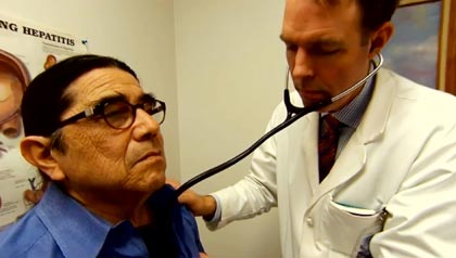 Doctor surveys Hepatitis C patient