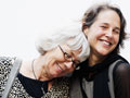 Portrait of a younger and older woman smiling illustrates story about a drug for alzheimer's disease