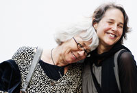 Portrait of a younger and older woman smiling illustrates story about a drug for alzheimer's disease Portrait of a younger and older woman smiling illustrates story about a drug for alzheimer's disease