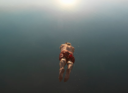 man diving into the water