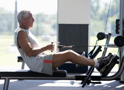 older man training in gym