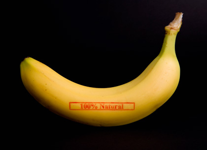 A banana stamped '100% Natural' A banana stamped '100% Natural'