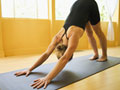 Woman in downward dog yoga pose