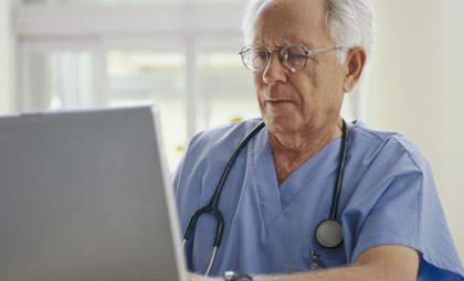 people in waiting area of hospital with surgeon people in waiting area of hospital with surgeon