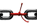 Steel chain held together with red string