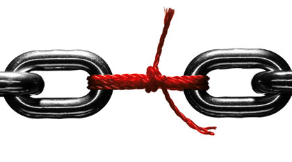 Steel chain held together with red string