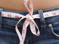 a tape measure as a belt in a pair of jeans