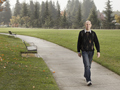 Rick Genter after his 200 pound weight loss, walking in a park. 