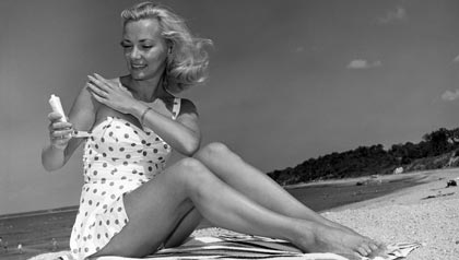 Young Woman; Beach; Sunblock; Suntan; Lotion; Summer; Sand; Face; SPF
