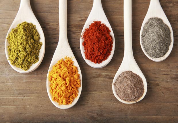 White spoons with dried spices, Discard old spices