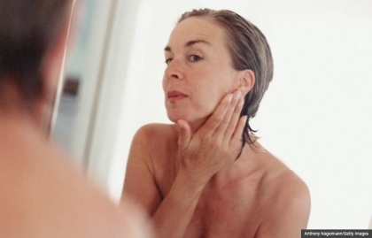 Woman washing face. Health quiz on skin care.