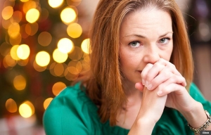 Stressed woman during the holidays, Holiday Tips for Caregivers (iStock)