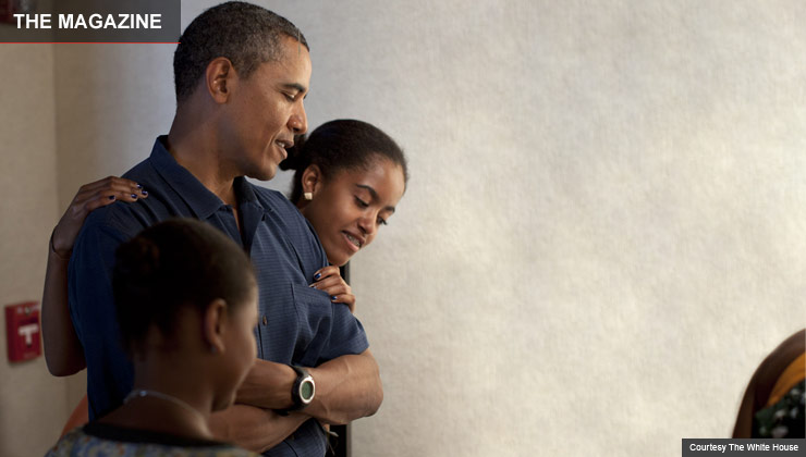 Barack Obama and daughters Sasha and Malia at an exhibit in Honolulu, Hawaii
