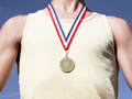 Raising an Olympic athlete- an athlete wearing a gold medal	