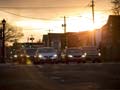 Cars intersection sunset, reduce traffic AARP New York