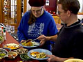 Takoma Village residents prepare for dinner in their communal dining area.