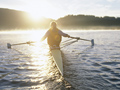 Sports and the outdoors draw active seniors to retire in Bellingham, Washington- a person rows on Lake Whatcom