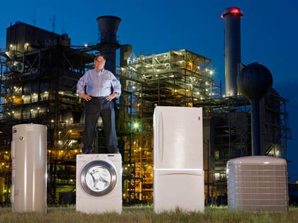 man standing atop energy efficient appliances man standing atop energy efficient appliances
