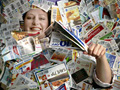 Janet Robinett, of Olathe, KS, pictured March 16, 2009 blanketed in coupons, teaches a BeCentsable workshop on frugal living.
