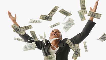 businesswoman throwing money in the air
