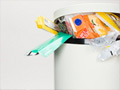 A rubbish bin overflowing with garbage