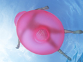 A person floats on a pink rubber raft in a pool 99 ways to save travel